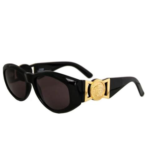 black versace sunglasses gold inside.